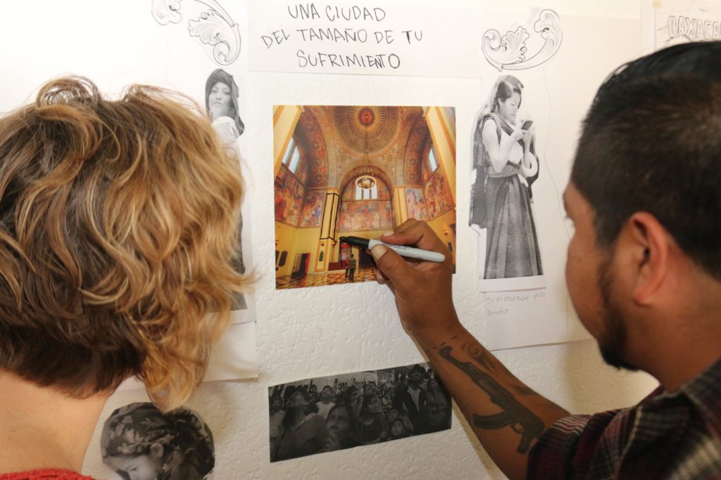 Artist Dario Canul sketching plans for the Rotunda exhibit.