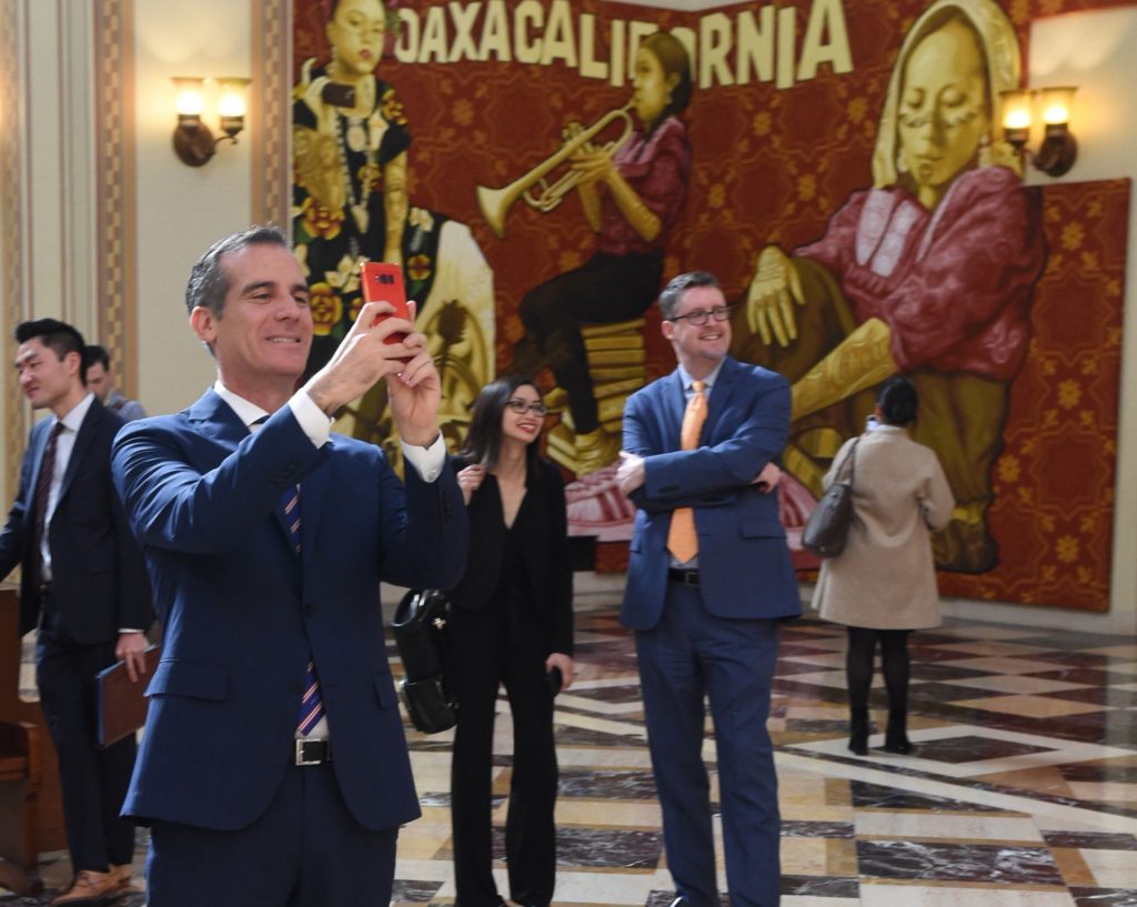 Mayor Eric Garcetti takes in the murals at Central Library.